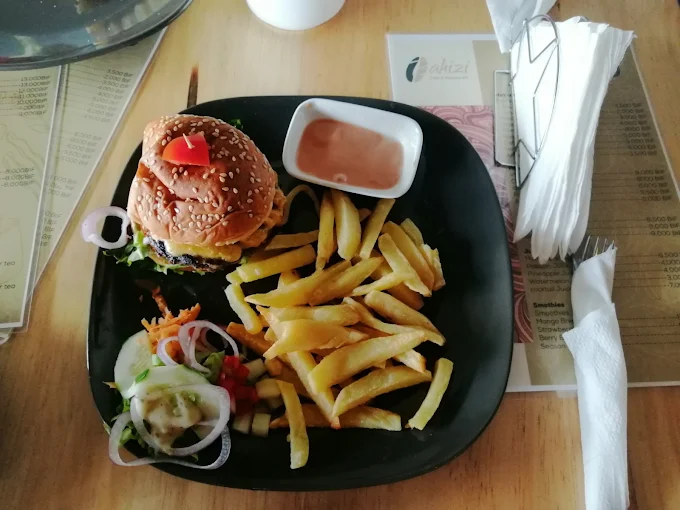Bahizi burger with fries and house sauce