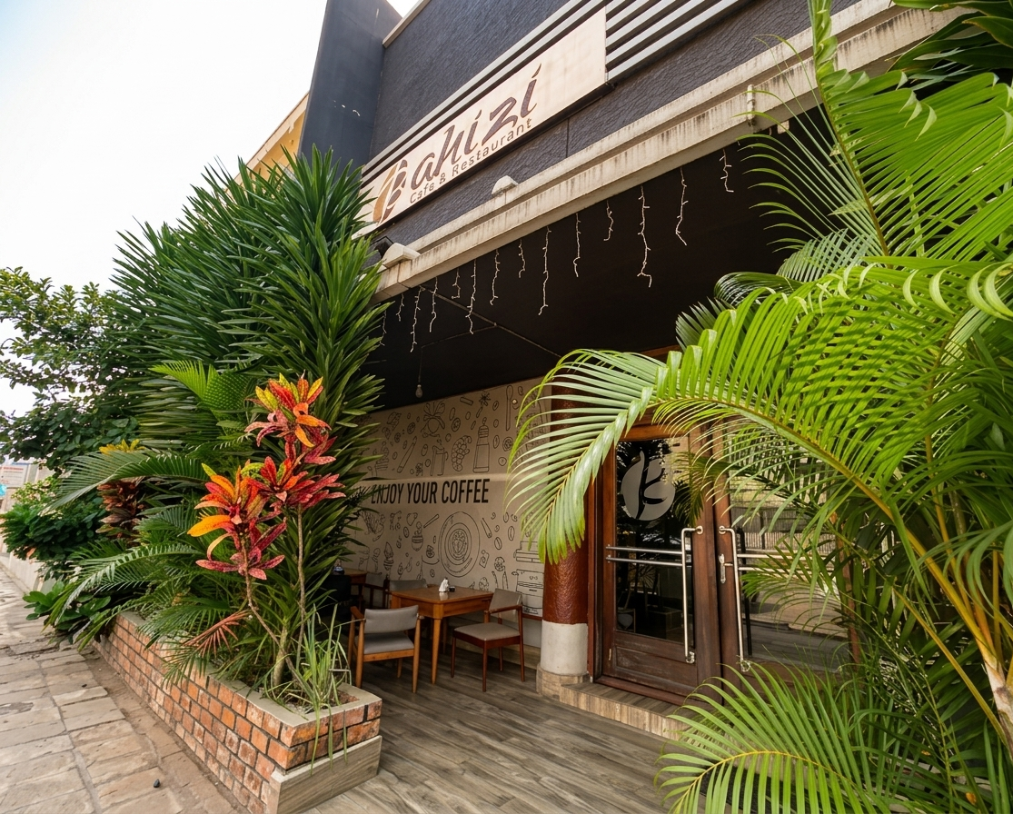Bahizi Café entrance with outdoor seating and greenery